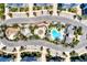 Aerial view of community pool, playground, and building at 395 Aruba Cir # 102, Bradenton, FL 34209