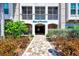 Welcoming entrance to Edge of Paradise community with landscaped walkway at 395 Aruba Cir # 102, Bradenton, FL 34209