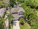 Two-story house with a driveway and lush landscaping at 1800 Robinhood St, Sarasota, FL 34231