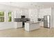 Modern kitchen with island, stainless steel appliances at 1800 Robinhood St, Sarasota, FL 34231