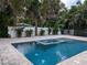 Relaxing pool and spa with a tranquil setting at 1800 Robinhood St, Sarasota, FL 34231
