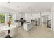 Modern kitchen with white cabinets and granite island at 1800 Robinhood St, Sarasota, FL 34231