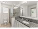 Bathroom features granite vanity, shower, and toilet at 1800 Robinhood St, Sarasota, FL 34231