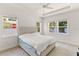 Bright bedroom with a plush bed and large windows at 1800 Robinhood St, Sarasota, FL 34231