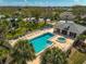 Community pool and spa with lounge chairs for relaxing at 4215 Caddie E Dr # 101, Bradenton, FL 34203