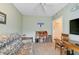 Den with seating area, writing desk and access to hallway at 4215 Caddie E Dr # 101, Bradenton, FL 34203