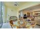 Bright sunroom with wicker furniture and lake view at 4215 Caddie E Dr # 101, Bradenton, FL 34203