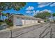 Three-car garage with white doors, and a shared driveway at 4215 Caddie E Dr # 101, Bradenton, FL 34203