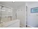 Bathroom with walk-in shower and granite countertop at 4215 Caddie E Dr # 101, Bradenton, FL 34203