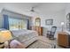 Bright bedroom with a king bed and views of the water at 4215 Caddie E Dr # 101, Bradenton, FL 34203
