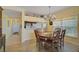 Dining room with wooden table and chairs and kitchen view at 4215 Caddie E Dr # 101, Bradenton, FL 34203
