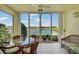 Sunroom features glass doors and lake view at 4215 Caddie E Dr # 101, Bradenton, FL 34203