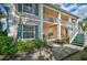 Condo building with covered patio and white railings at 4215 Caddie E Dr # 101, Bradenton, FL 34203