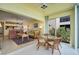 Sunroom with glass doors and view to the living room at 4215 Caddie E Dr # 101, Bradenton, FL 34203