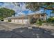 Condo building with a shared driveway and attached garages at 4215 Caddie E Dr # 101, Bradenton, FL 34203