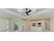 Modern kitchen with white cabinets, center island, and stainless steel appliances at 8380 Malcolm Ave, North Port, FL 34287