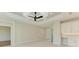 Versatile bonus room with hardwood floors, white cabinets, and access to other rooms at 8380 Malcolm Ave, North Port, FL 34287