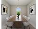 Bright dining room with a large wood table and white chairs at 8380 Malcolm Ave, North Port, FL 34287