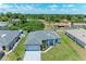 Aerial view of a house, highlighting its gray roof and paved driveway at 8380 Malcolm Ave, North Port, FL 34287