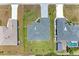 Overhead view of a house with a gray roof and a surrounding landscape at 8380 Malcolm Ave, North Port, FL 34287
