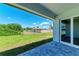 Spacious backyard with grassy area and partially visible fence at 8380 Malcolm Ave, North Port, FL 34287