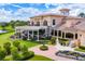 Upscale clubhouse with a large patio and spiral staircase at 13906 Siena Loop, Lakewood Ranch, FL 34202