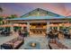 Outdoor community bar with seating, fire pit, and umbrellas at 13721 Palazzo Ter, Bradenton, FL 34211