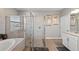 Beautiful bathroom featuring a separate soaking tub and glass enclosed shower at 15739 Barefoot Beach Dr, Bradenton, FL 34211