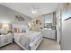 Bedroom with soft natural lighting, and a decorative coastal theme, dresser and nightstands at 15739 Barefoot Beach Dr, Bradenton, FL 34211