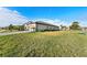 Spacious lawn surrounds this well maintained single Gathering home at 15739 Barefoot Beach Dr, Bradenton, FL 34211