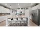 Bright kitchen with large island and seating, offering stainless appliances at 15739 Barefoot Beach Dr, Bradenton, FL 34211