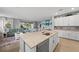 Open kitchen with stainless steel appliances and a living room view at 15739 Barefoot Beach Dr, Bradenton, FL 34211