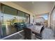 Covered patio features comfortable outdoor seating and a large sliding glass door for seamless indoor-outdoor living at 15739 Barefoot Beach Dr, Bradenton, FL 34211