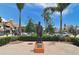 Outdoor town square with a statue and lush landscaping at 100 Sands Point Rd # 324, Longboat Key, FL 34228