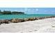 Scenic beach view with white sand and turquoise water at 100 Sands Point Rd # 324, Longboat Key, FL 34228