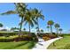Landscaped walkway leading to the beach and community pool at 100 Sands Point Rd # 324, Longboat Key, FL 34228
