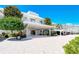 Modern building with covered parking and landscaping at 100 Sands Point Rd # 324, Longboat Key, FL 34228