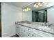 Elegant bathroom with double sinks, granite countertop, and large shower at 100 Sands Point Rd # 324, Longboat Key, FL 34228
