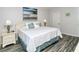 Spacious Primary bedroom with king-size bed and updated flooring at 100 Sands Point Rd # 324, Longboat Key, FL 34228