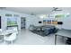 Open living area featuring contemporary furniture and a kitchenette at 100 Sands Point Rd # 324, Longboat Key, FL 34228