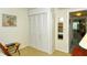 Bedroom with mirrored closet doors and access to hallway at 100 Sands Point Rd # 324, Longboat Key, FL 34228