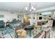 Bright dining area with glass table and seating for six at 100 Sands Point Rd # 324, Longboat Key, FL 34228
