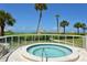 Relaxing hot tub with ocean views and lush landscaping at 100 Sands Point Rd # 324, Longboat Key, FL 34228