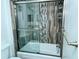 Clean bathroom featuring a tub/shower combo with modern tile at 100 Sands Point Rd # 324, Longboat Key, FL 34228