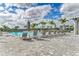 Resort-style pool with lounge chairs and umbrellas at 15739 Barefoot Beach Dr, Bradenton, FL 34211