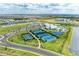 Aerial view of community amenities including pool, tennis, and basketball courts at 15739 Barefoot Beach Dr, Bradenton, FL 34211