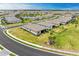 Aerial view of community with houses and landscaping at 15739 Barefoot Beach Dr, Bradenton, FL 34211