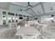 Relaxing outdoor patio with seating and ceiling fans at 15739 Barefoot Beach Dr, Bradenton, FL 34211