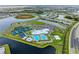 Aerial view of community amenities including pool, tennis, and basketball courts at 15739 Barefoot Beach Dr, Bradenton, FL 34211