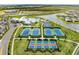 Aerial view of community amenities including pool, tennis, and basketball courts at 15739 Barefoot Beach Dr, Bradenton, FL 34211